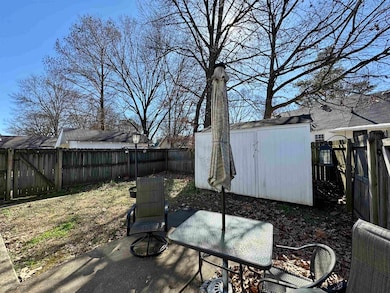 There's a nice concrete patio inside the fenced back yard, as well as a 5x8 storage shed.