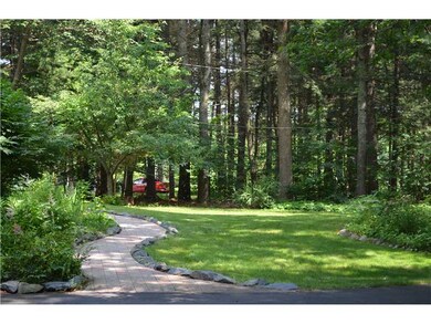 Exterior Front. The gracious curved front walkway