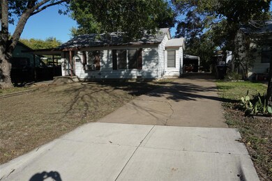 View of front of property featuring a carport
