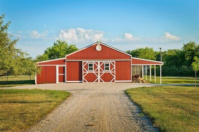 Barn with concrete floor, storage space, and fenci