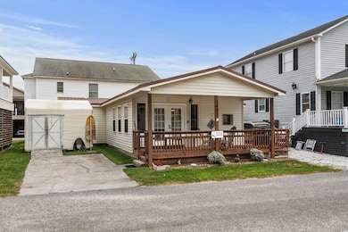 View of front of property with an outdoor structure