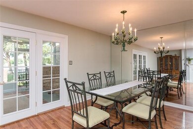 Dining room with mirrored wall.