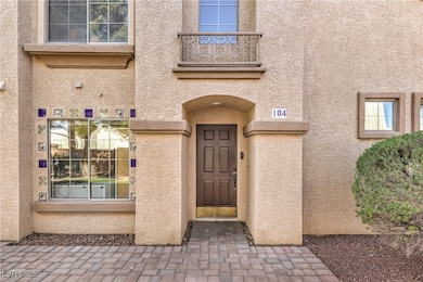 Entrance to property with stucco siding