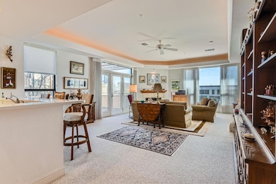 Living room with visible vents, crown molding, li