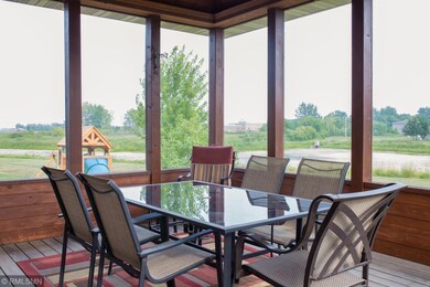 This spacious 14 x 16 screen porch features ceilin