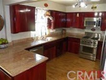 Spacious kitchen with stainless steel appliance, g