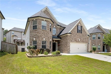 View of front of property featuring driveway, an attached garage, brick siding, and roof with shingles