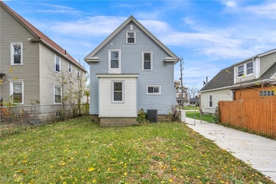 Back of property with a fenced backyard and a residential view