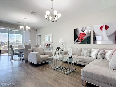 Living room featuring wood finished floors, visibl