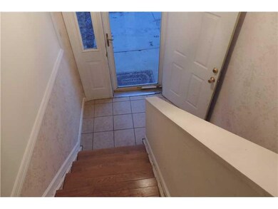 Entry/Foyer. The newly tiled entryway leads to the