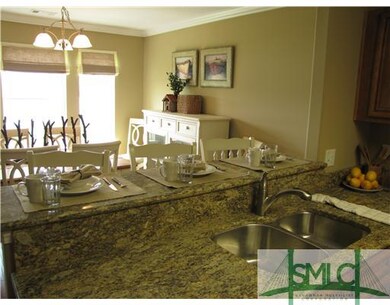 Kitchen. Granite Breakfast Bar opens to Dining Roo