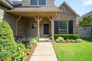 Charming covered porch & beautiful landscaping wel