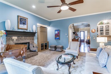 Another view of living room looking into the wet bar and foyer.