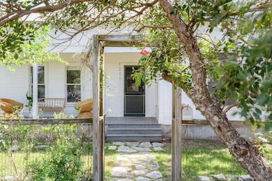 Property entrance featuring covered porch