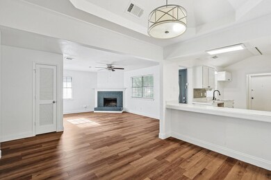 Unfurnished living room featuring hardwood / wood-