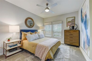Bedroom featuring carpet flooring, a ceiling fan, 