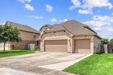Drive up the expansive triple-wide driveway, offer