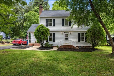 Colonial home featuring a front yard