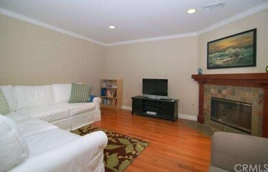 Living room with fireplace, crown molding and rece