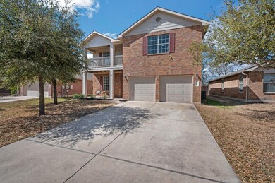 Traditional-style home featuring concrete drivewa