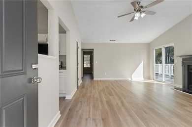 Unfurnished living room featuring a fireplace with