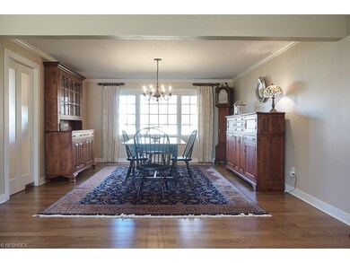 Large dining room with lots of light, and swinging