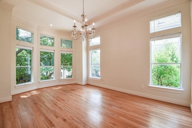 Elegant dining room with abundant natural light fr