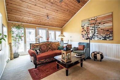 The light-filled living room with access to the back porch.