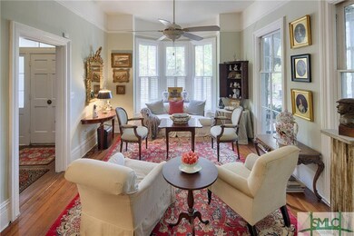 Gracious parlor generously sized for entertaining.