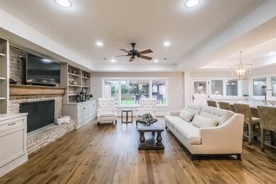Generous Family Room with raised ceilings and Fren