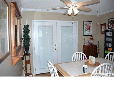 Dining Room With French Doors to Screened Deck