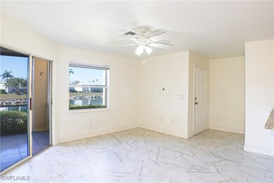 Spare room featuring a water view and ceiling fan