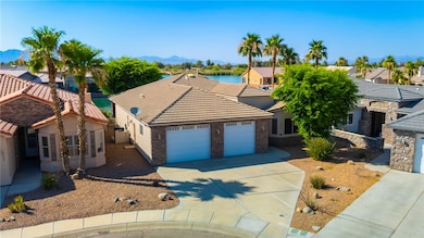 View of front facade featuring a garage, driveway,