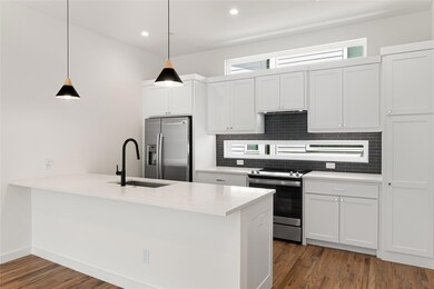 Kitchen featuring appliances with stainless steel 