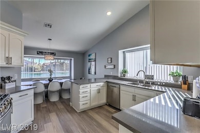 Kitchen featuring stainless steel appliances, a si