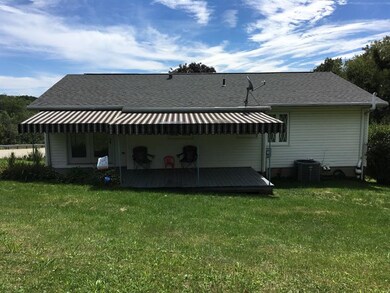 Back Exterior with Awning Covered Deck