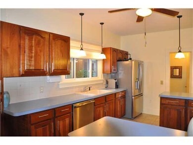 Kitchen. Pendant lights illuminate the  kitchen wi
