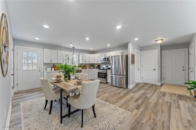 View to front door, garage, laundry room and coat closet