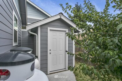 Outbuilding that is currently being used for air compressor storage.