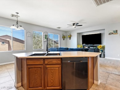 Kitchen featuring dishwasher, open floor plan, lig