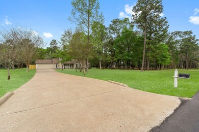 Long driveway that opens up to a double-wide driveway by the garage. The house sits approx 140' from the street with another 140' in the back.