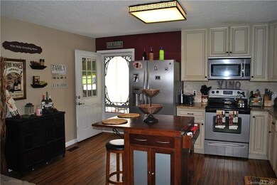 Full kitchen with gleaming bamboo floors throughou