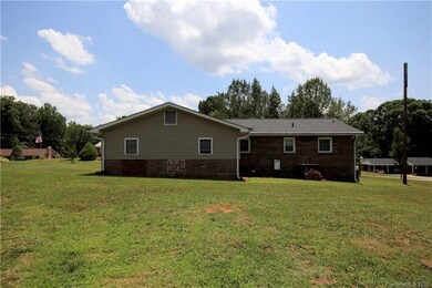 Back of this beautiful home with views of the larg