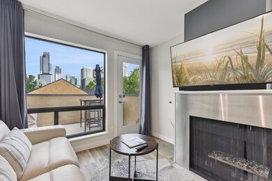 Living area featuring baseboards, wood finished f