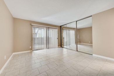 Unfurnished room featuring light tile patterned fl