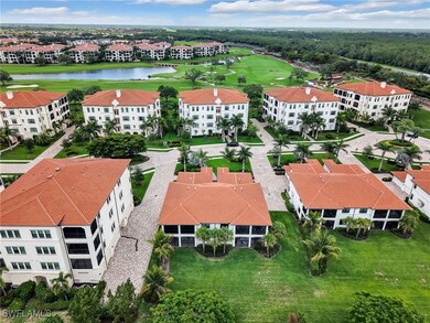 Aerial view of a golf course, a nearby body of wat