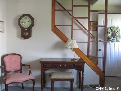 Living Room. A open staircase makes the living roo