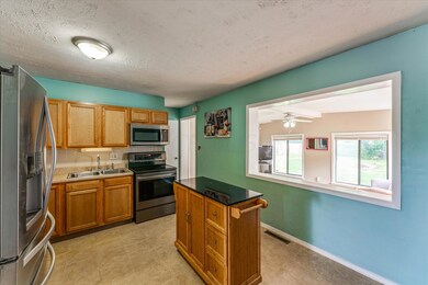 kitchen with opening to 4 season room