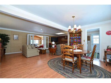 Living Room. At front door looking into dining are