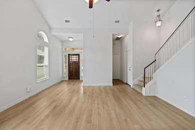 Unfurnished living room with light wood-style flo